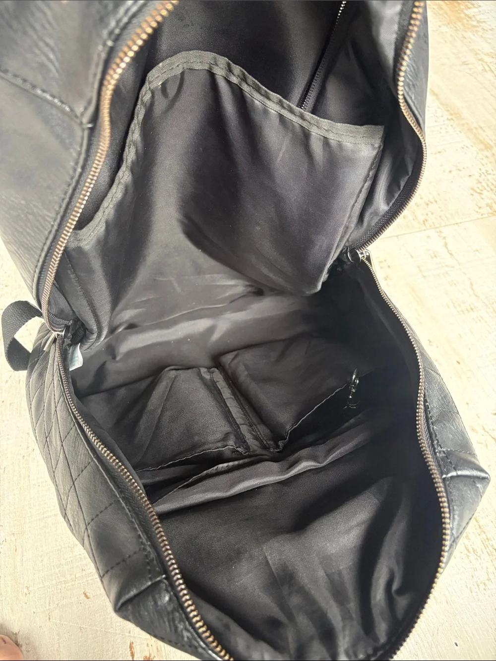 The Honest Company Diamond Quilted Black Faux Leather Backpack